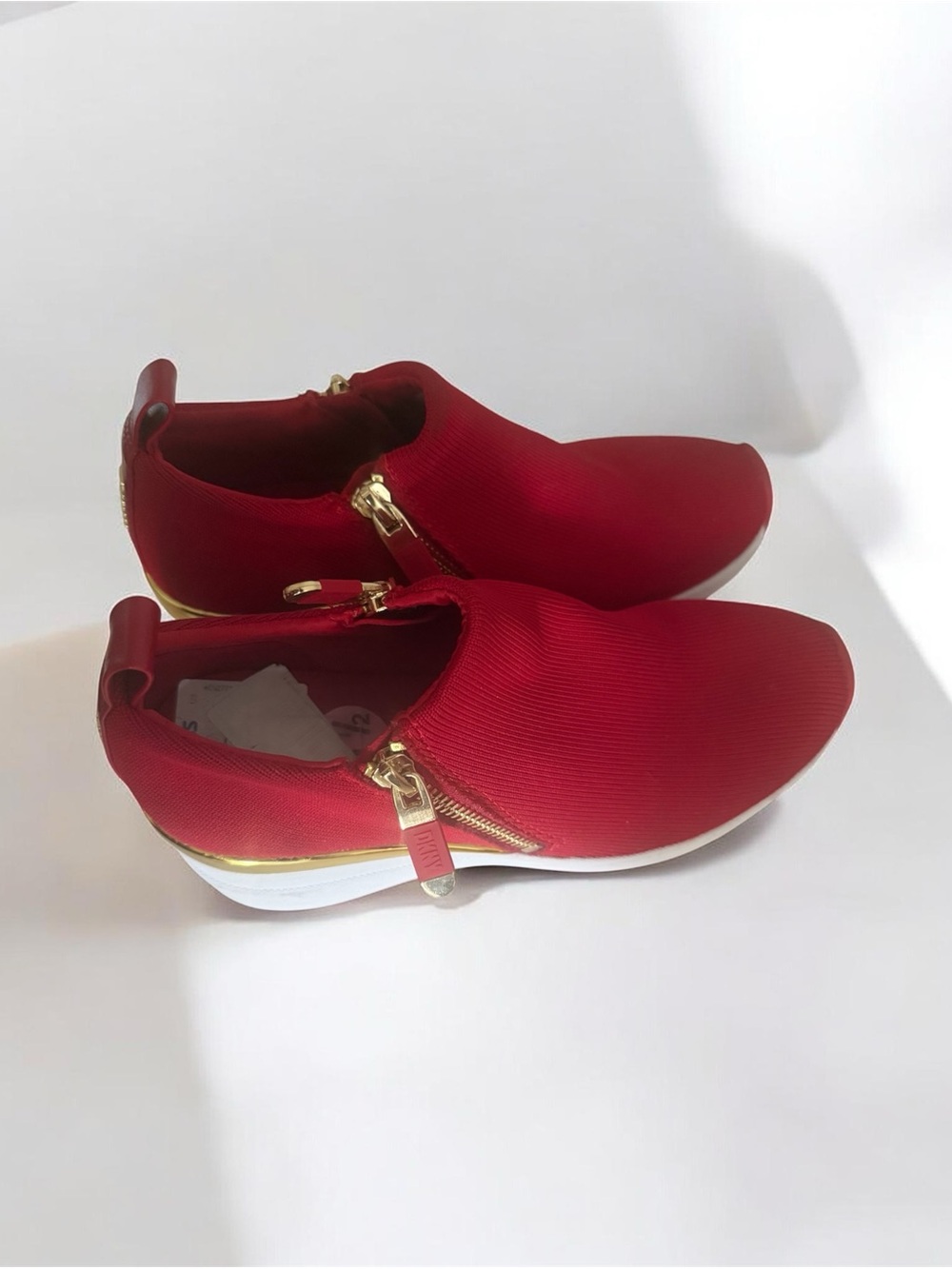 DKNY Red Slip-On Sneakers with Gold Hardware